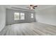 Expansive main bedroom with tray ceiling and large windows at 16 Camellia Dr, Fairburn, GA 30213