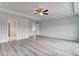 Spacious main bedroom featuring a ceiling fan and a view into the ensuite bathroom at 16 Camellia Dr, Fairburn, GA 30213