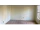 Spacious carpeted bedroom with a large window at 1461 Fox Forest Sw Ter, Lilburn, GA 30047