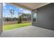 Covered patio with gray siding and a beautiful view of the lush backyard at 231 Strawberry Ln, Woodstock, GA 30189