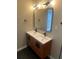 Bathroom with double vanity and hexagon tile floor at 11 Newport Nw Pl, Atlanta, GA 30318