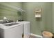 Laundry room with washer, dryer, and shelving at 2720 Ravencliff Dr, Austell, GA 30168