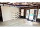 Unfinished basement with doorway to backyard pool area and exposed ceiling at 512 Cooper Lake Se Rd, Mableton, GA 30126