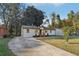 Charming, single-story home with a well-maintained lawn and a lengthy driveway with ample parking space at 2349 Springdale Sw Rd, Atlanta, GA 30315