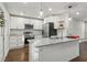 Modern kitchen with stainless steel appliances, granite countertops, and white subway tile backsplash at 2349 Springdale Sw Rd, Atlanta, GA 30315