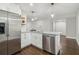 Modern kitchen features stainless appliances, white cabinets, granite counters and subway tile backsplash at 2349 Springdale Sw Rd, Atlanta, GA 30315