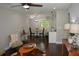 Inviting living room features wood floors and a seamless connection to a stylish kitchen and dining area at 2349 Springdale Sw Rd, Atlanta, GA 30315