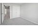 Bedroom featuring double door closet, neutral carpet, and ample space at 3102-A Brownstone Se Ln, Atlanta, GA 30354