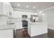 Modern kitchen with white cabinets, granite countertops and island at 3102-B Brownstone Se Ln, Atlanta, GA 30354