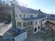 Rear view of a tan two-story home under construction, showcasing a deck at 1210 Lupo Loop, Chattahoochee Hills, GA 30268