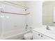 Bathroom featuring white tile, a tub, a shower, and vanity sink at 3330 Madison St, Atlanta, GA 30337