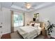 Well-lit bedroom with neutral decor, a cozy bed, and a large window at 3330 Madison St, Atlanta, GA 30337