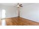 A spacious bedroom with hardwood floors, white walls, crown molding, and natural light at 3330 Madison St, Atlanta, GA 30337