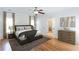 Serene main bedroom showcasing plush bedding, soft neutral tones, and an adjoining bathroom at 3330 Madison St, Atlanta, GA 30337