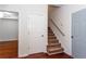 Staircase featuring carpeted steps, and a light grey wall at 3330 Madison St, Atlanta, GA 30337