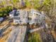 Aerial view of a gray house, detached garage, and yard at 6724 Oakland Dr, Douglasville, GA 30135