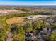 Aerial view showing home, trees, and nearby buildings at 6724 Oakland Dr, Douglasville, GA 30135