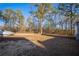 Open backyard with trees and boat storage at 6724 Oakland Dr, Douglasville, GA 30135