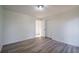 Bright bedroom with wood-look floors and double closets at 6724 Oakland Dr, Douglasville, GA 30135