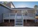 Gray deck with stairs leading to backyard at 6724 Oakland Dr, Douglasville, GA 30135