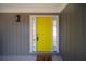 Bright yellow front door with sidelights at 6724 Oakland Dr, Douglasville, GA 30135