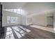 Sunlit living room boasts hardwood floors, high ceilings and ample natural light at 6724 Oakland Dr, Douglasville, GA 30135