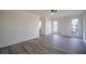 Sunlit living room featuring wood-look floors and large windows at 6724 Oakland Dr, Douglasville, GA 30135