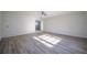 Spacious living room with hardwood floors and view into kitchen at 6724 Oakland Dr, Douglasville, GA 30135