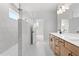 Bright and modern bathroom with walk-in shower and double vanity at 7675 Homer Dr, Cumming, GA 30028