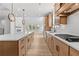 Spacious kitchen with a large island and stainless steel appliances open to the living area at 7675 Homer Dr, Cumming, GA 30028