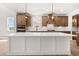 Elegant kitchen with a large center island, stainless steel appliances, and ample cabinet space at 7675 Homer Dr, Cumming, GA 30028