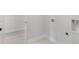 A conveniently placed laundry room equipped with hookups for washer and dryer, for easy laundry at 7675 Homer Dr, Cumming, GA 30028