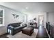 Comfortable loft area with plush seating, creating a cozy space for relaxation and entertainment at 7675 Homer Dr, Cumming, GA 30028