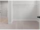Empty walk-in closet with white wire shelving at 7675 Homer Dr, Cumming, GA 30028