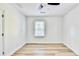 Well-lit bedroom featuring hardwood floors and a ceiling fan at 2502 Tupelo Se St, Atlanta, GA 30317