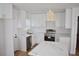 Modern kitchen with white shaker cabinets, stainless steel appliances, and a large island at 2502 Tupelo Se St, Atlanta, GA 30317