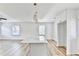 Modern kitchen with white cabinets, quartz countertops, and a large island at 2502 Tupelo Se St, Atlanta, GA 30317