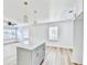 Modern kitchen with white cabinets, quartz countertops and island at 2502 Tupelo Se St, Atlanta, GA 30317