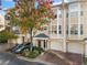 Attractive 3-story townhome with autumn trees and a Volvo in the driveway at 375 Highland Ne Ave # 908, Atlanta, GA 30312