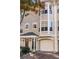 Tan three-story townhome with bay windows and attached garage at 375 Highland Ne Ave # 908, Atlanta, GA 30312