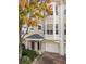 Tan three-story townhome with bay windows and attached garage at 375 Highland Ne Ave # 908, Atlanta, GA 30312