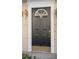 Dark gray front door with brass hardware and a decorative window at 375 Highland Ne Ave # 908, Atlanta, GA 30312