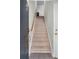 Carpeted staircase leading to the upper level of the home at 375 Highland Ne Ave # 908, Atlanta, GA 30312