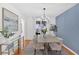 Bright dining room with hardwood floors and a large window at 3619 Spring Leaf Ln, Acworth, GA 30101