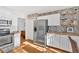 Updated kitchen with white cabinets and butcher block counters at 3619 Spring Leaf Ln, Acworth, GA 30101