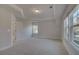 Bedroom with tray ceiling, carpet, and multiple windows at 4060 Andover Cir, Mcdonough, GA 30252