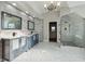 Elegant bathroom featuring double vanity, walk-in shower, and stylish tile flooring at 2195 Lake Shore Lndg, Alpharetta, GA 30005