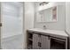 Charming bathroom with sliding barn doors and a tiled shower at 2195 Lake Shore Lndg, Alpharetta, GA 30005