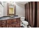 Bathroom features a granite vanity, framed mirror, and neutral color scheme at 2195 Lake Shore Lndg, Alpharetta, GA 30005