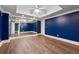 A large bedroom with a mirror wall and laminate flooring at 2195 Lake Shore Lndg, Alpharetta, GA 30005